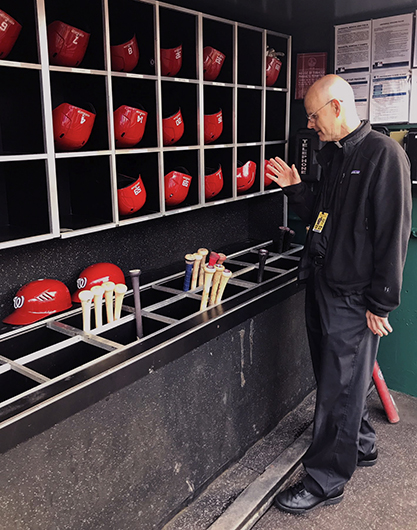 Msgr. Stephen J. Rossetti, a professor at The Catholic University of America and the chaplain for the Washington Nationals, blesses bats before a game during the 2019 season. (CNS photo/courtesy Msgr. Stephen J. Rossetti) 