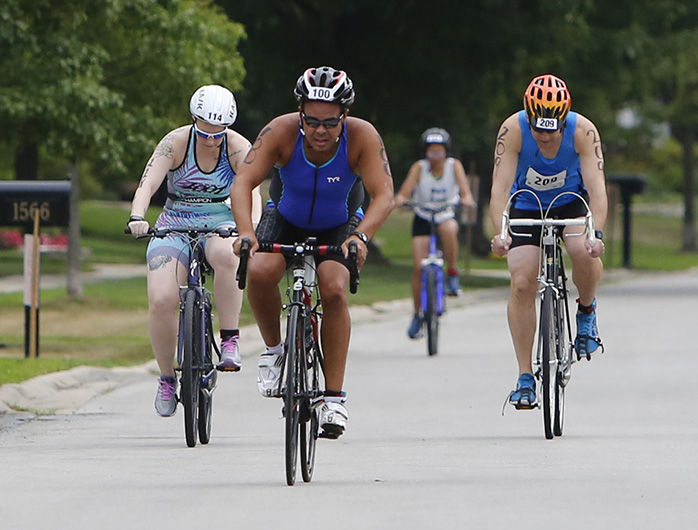 Pastor uses 100th triathlon to raise money for his parish Photos