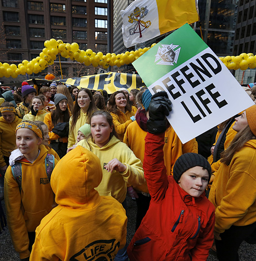 Illinois March for Life participants proclaim “women deserve