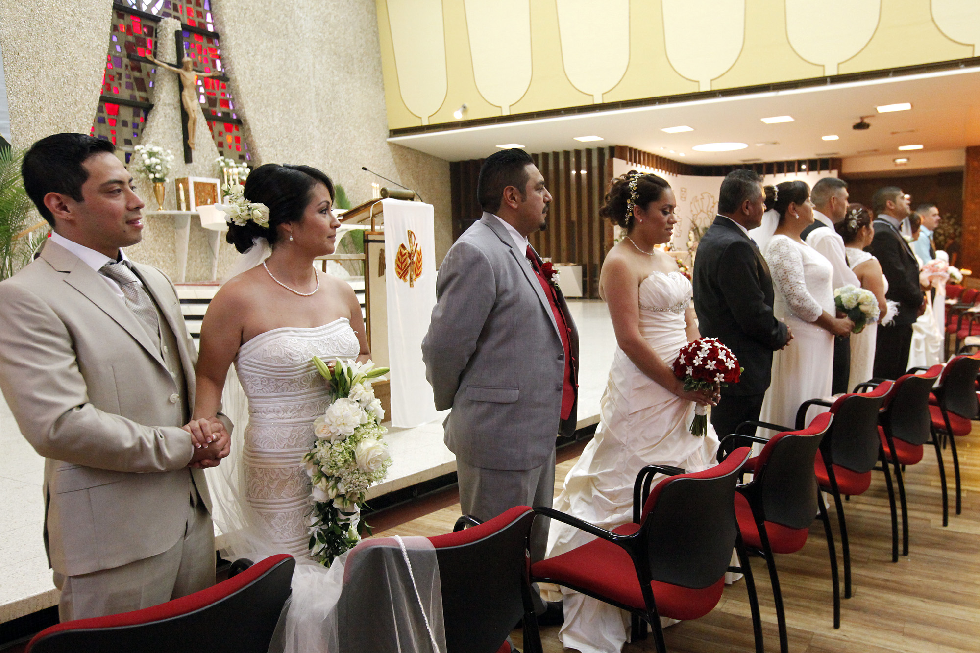 Nine couples receive blessings at community wedding